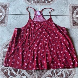 Red top with pink flower bouquets.